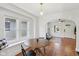 Cozy dining area with a round table, window seating, and bright natural light at 1421 S New Jersey St, Indianapolis, IN 46225
