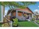 Craftsman-style home with inviting front porch, landscaping, and a fenced yard at 1421 S New Jersey St, Indianapolis, IN 46225
