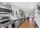 Modern kitchen with stainless steel appliances and gray cabinets at 1421 S New Jersey St, Indianapolis, IN 46225