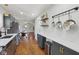 Open kitchen leading to dining room with hardwood floors and stainless steel appliances at 1421 S New Jersey St, Indianapolis, IN 46225