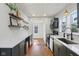 Bright kitchen with white countertops, dark gray cabinets, and stainless steel appliances at 1421 S New Jersey St, Indianapolis, IN 46225