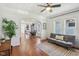 Open-concept living area with hardwood floors and seamless flow to dining and kitchen at 1421 S New Jersey St, Indianapolis, IN 46225