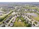 Extensive aerial view of homes in a planned community featuring ponds, playgrounds, and green spaces at 14353 Chariots Whisper Dr, Carmel, IN 46074