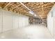 Large unfinished basement with concrete foundation, exposed ceiling and ample space for future customization at 14353 Chariots Whisper Dr, Carmel, IN 46074
