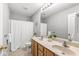 Well-maintained bathroom with double sinks and a shower with curtain at 14353 Chariots Whisper Dr, Carmel, IN 46074
