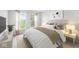 Bright bedroom featuring two windows, cozy bedding, and neutral decor for a serene atmosphere at 14353 Chariots Whisper Dr, Carmel, IN 46074