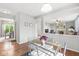 Dining room with hardwood floors, with a view of the living room at 14353 Chariots Whisper Dr, Carmel, IN 46074