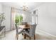 Dining room with large window and chandelier at 14353 Chariots Whisper Dr, Carmel, IN 46074