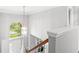Grand two story foyer with chandelier and an arched window over the front door allowing ample natural light at 14353 Chariots Whisper Dr, Carmel, IN 46074