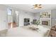 Spacious living room with fireplace and view of entry at 14353 Chariots Whisper Dr, Carmel, IN 46074
