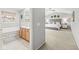 Spacious main bedroom with vaulted ceilings, carpet, and a peek into the connected bathroom at 14353 Chariots Whisper Dr, Carmel, IN 46074
