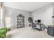 Comfortable home office space, with neutral carpet, natural light, and ample storage at 14353 Chariots Whisper Dr, Carmel, IN 46074
