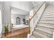 Open floor plan with beautiful staircase leading to the second floor, and hardwood flooring at 14353 Chariots Whisper Dr, Carmel, IN 46074