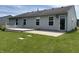 Exterior of home featuring a spacious backyard with a deck, patio, and well-maintained lawn at 1562 Prairieview Ln, Greenfield, IN 46140