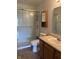 Bathroom featuring a tiled floor, shower, sink, toilet, vanity, mirror, and lighting at 1562 Prairieview Ln, Greenfield, IN 46140