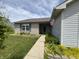 Inviting front of a single-story home with brick facade and tidy landscaping leading to the entrance at 1562 Prairieview Ln, Greenfield, IN 46140