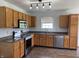 Traditional kitchen with oak cabinets, granite countertops, and stainless steel appliances at 1562 Prairieview Ln, Greenfield, IN 46140
