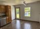 Well-lit kitchen area with stainless steel appliances, granite counters, and access to the backyard at 1562 Prairieview Ln, Greenfield, IN 46140