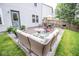 Outdoor patio with a wicker sofa, umbrella, and barbecue grill at 17841 Grassy Knoll Dr, Westfield, IN 46074