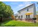 Enjoy outdoor living on the patio, complete with dining set, grill, and playset, in a spacious backyard at 17841 Grassy Knoll Dr, Westfield, IN 46074