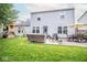 Exterior view of the home featuring a backyard with a playset and patio area at 17841 Grassy Knoll Dr, Westfield, IN 46074