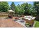 An outdoor patio with furniture set on a stamped concrete slab and lawn, and fenced perimeter at 17841 Grassy Knoll Dr, Westfield, IN 46074
