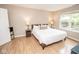 Bright bedroom offers a comfortable bed, window and tranquil views at 17841 Grassy Knoll Dr, Westfield, IN 46074