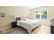 Neutral bedroom featuring hardwood flooring, a large window, and natural light at 17841 Grassy Knoll Dr, Westfield, IN 46074