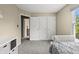 Bedroom with plush carpeting, neutral walls, triple closets, and bright window view at 17841 Grassy Knoll Dr, Westfield, IN 46074