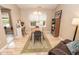 Bright dining area featuring a table and chairs, complemented by a bookshelf and natural light from the window at 17841 Grassy Knoll Dr, Westfield, IN 46074