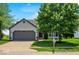 Beautiful home featuring a well-manicured lawn, attached garage, lovely front yard tree, and desirable curb appeal at 17841 Grassy Knoll Dr, Westfield, IN 46074