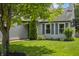 Close up of charming home featuring well-manicured lawn and front garden at 17841 Grassy Knoll Dr, Westfield, IN 46074