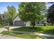 Charming single-Gathering home featuring a gray two-car garage and well-manicured lawn with mature trees at 17841 Grassy Knoll Dr, Westfield, IN 46074