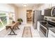 Bright eat-in kitchen with stainless appliances and access to outdoor dining and backyard at 17841 Grassy Knoll Dr, Westfield, IN 46074
