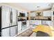 Galley kitchen with white cabinets, black countertops, and stainless steel appliances at 17841 Grassy Knoll Dr, Westfield, IN 46074