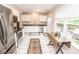 Bright and airy kitchen with stainless steel appliances and access to the backyard at 17841 Grassy Knoll Dr, Westfield, IN 46074