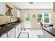 Kitchen features stainless steel sink, white cabinets, and neutral countertops at 17841 Grassy Knoll Dr, Westfield, IN 46074