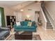 Open-concept living room featuring hardwood floors, neutral colors, and access to the second floor at 17841 Grassy Knoll Dr, Westfield, IN 46074