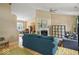 Open-concept living room featuring hardwood floors, a fireplace, and comfortable seating at 17841 Grassy Knoll Dr, Westfield, IN 46074