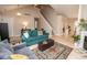 Comfortable living area with wood floors that flows to other parts of the house, offering style and functionality at 17841 Grassy Knoll Dr, Westfield, IN 46074
