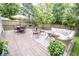 Outdoor patio features a dining set, seating area, and beautiful landscaping at 17841 Grassy Knoll Dr, Westfield, IN 46074