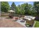 Relaxing outdoor patio area with comfortable seating, dining space, and lush greenery, perfect for entertaining at 17841 Grassy Knoll Dr, Westfield, IN 46074