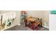 Playroom with a table and chairs, a bookshelf, and neutral carpet at 17841 Grassy Knoll Dr, Westfield, IN 46074
