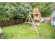 Spacious backyard with a wooden playset, swing set, and a grassy area for activities at 17841 Grassy Knoll Dr, Westfield, IN 46074