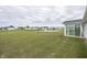 Expansive backyard view featuring a serene pond and lush greenery at 1863 River Birch Dr, Greenfield, IN 46140