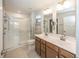 Modern bathroom with double vanity, tiled shower, and contemporary fixtures at 1863 River Birch Dr, Greenfield, IN 46140