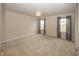 Large bedroom with neutral carpet, ceiling fan, and two windows at 1863 River Birch Dr, Greenfield, IN 46140