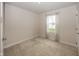 Bright bedroom with neutral carpet and one window with natural light at 1863 River Birch Dr, Greenfield, IN 46140