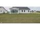 Exterior of home with a sunroom and lush lawn at 1863 River Birch Dr, Greenfield, IN 46140