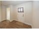 Bright entryway featuring wood-look flooring, neutral walls, and a modern front door at 1863 River Birch Dr, Greenfield, IN 46140
